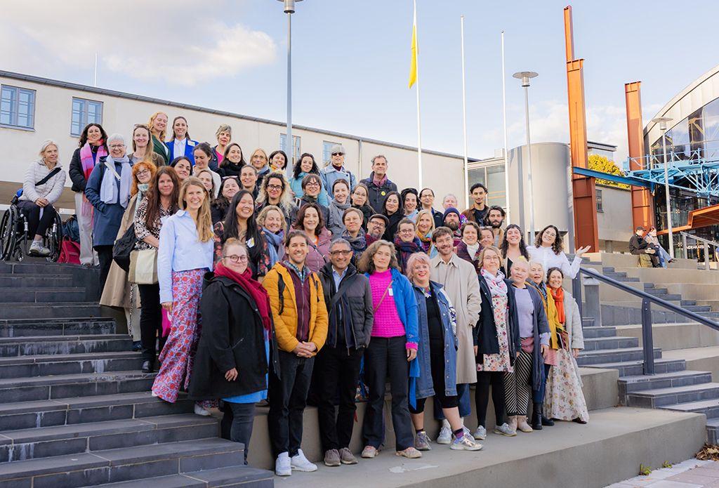 People standing on the stairs outside.